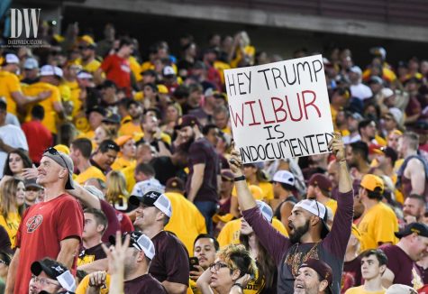 An Arizona State fan holds up a sign calling Wilbur Wildcat "undocumented" during the UA-ASU rivalry game on Nov. 25 at Sun Devil Stadium.