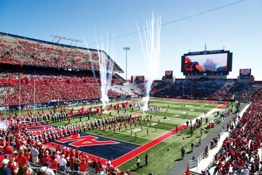 The+Wildcats+enter+the+field+before+playing+against+Washington+State+in+a+half+full+Arizona+Stadium+on+Oct.+24%2C+2015.