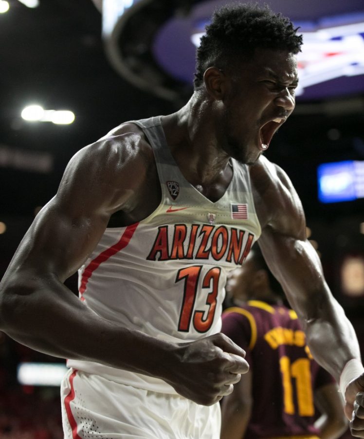 Arizonas Deandre Ayton shows a barrage of emotion after picking up an and-one late in the UA-ASU game. Ayton had 23 points.