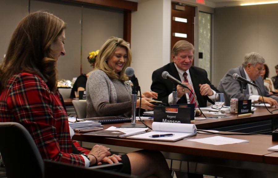 Regent Lyndel Manson, President Eileen Klein, Chair Bill Ridenour and Vice Chair Ron Shoopman smile at the Arizona Board of Regents special meeting on Wednesday, Dec 13. Regents discussed presidents contracts and new cost study and financial aid reports.  