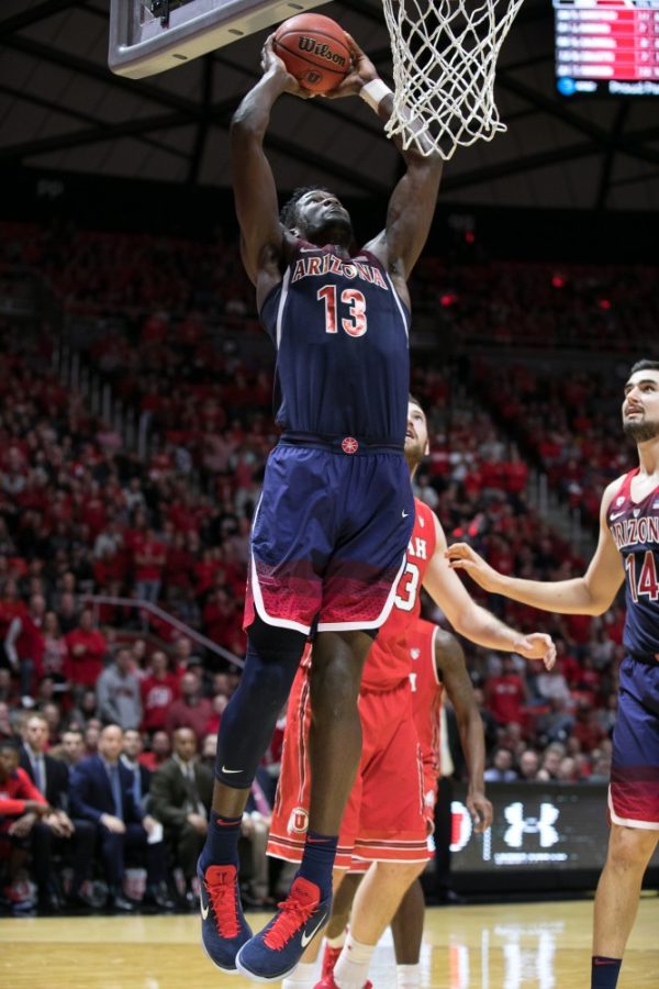Arizonas+Deandre+Ayton+%2813%29+jumps+to+slam+the+ball+off+an+offensive+rebound.+Ayton+had+a+double-double+with+24+points+and+14+rebounds.