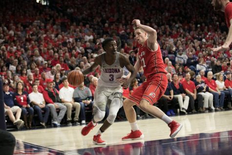 Arizona's Dylan Smith (3) looks for a teammate to pass to past Utah's Chris Seeley (11).