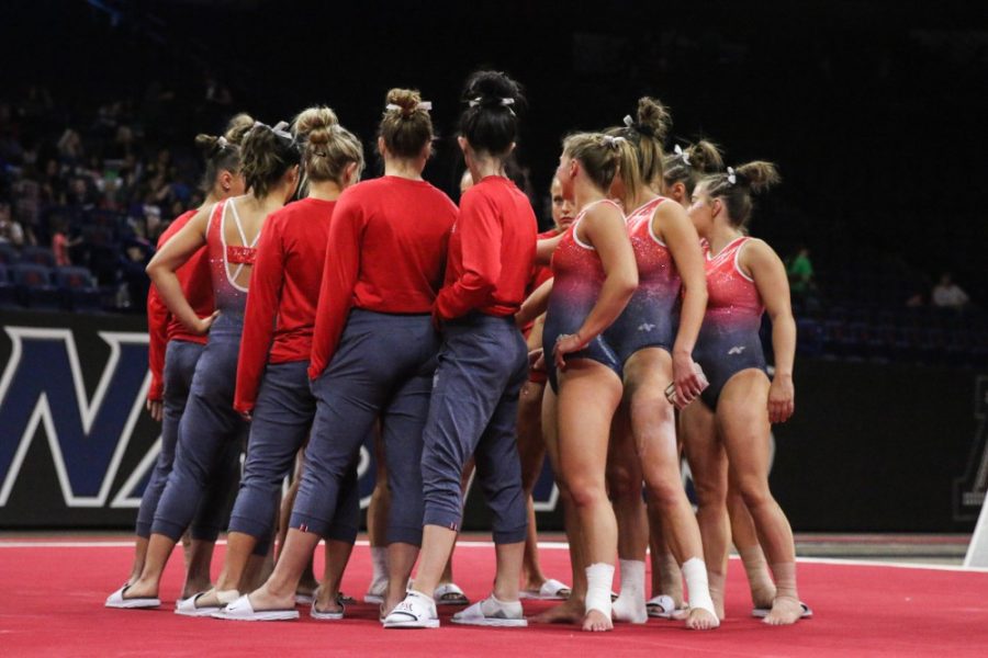 Arizona gymnastics huddles together before their meet against Denver on Jan. 6 in McKale Center. 