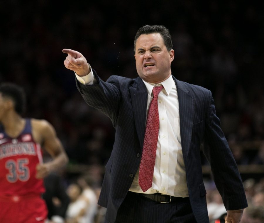 Arizona Mens Basketball Head Coach Sean Miller angrily disagrees with a foul called by a referee.