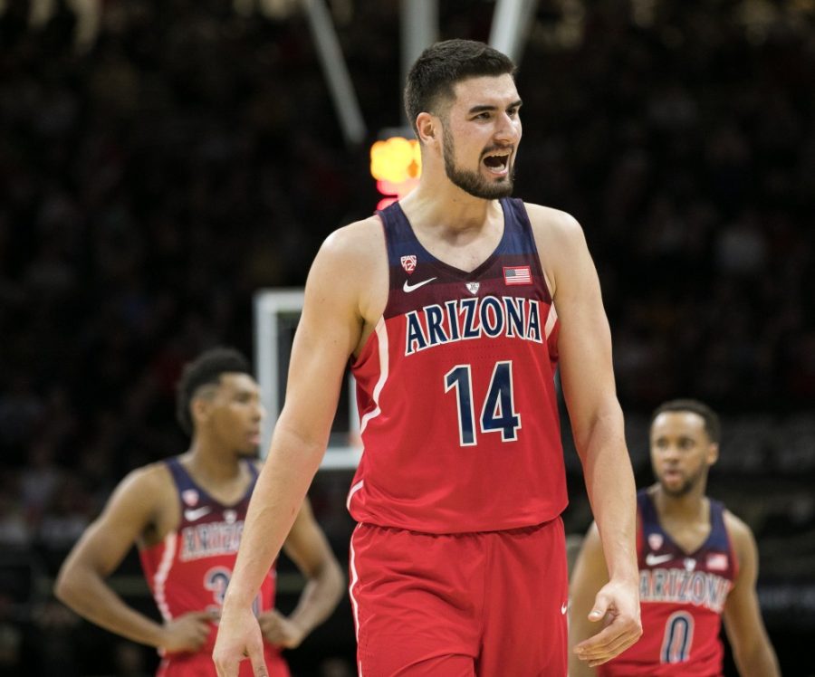 Arizonas Dusan Ristic shows emotion after a teammate completed a three pointer in the first half.