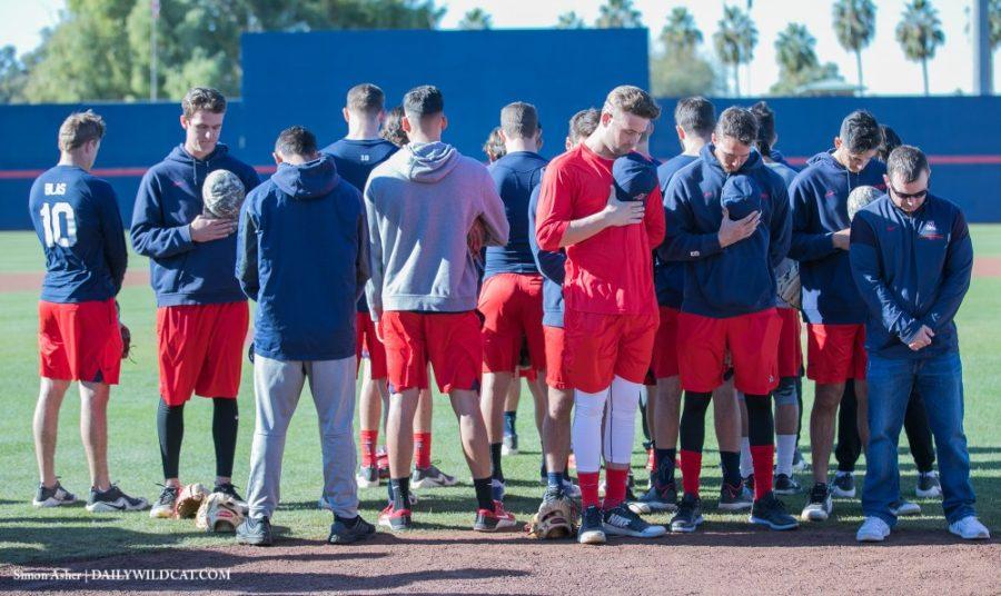 The+Arizona+Baseball+team+takes+a+moment+of+silence+before+the+Alumni+game.