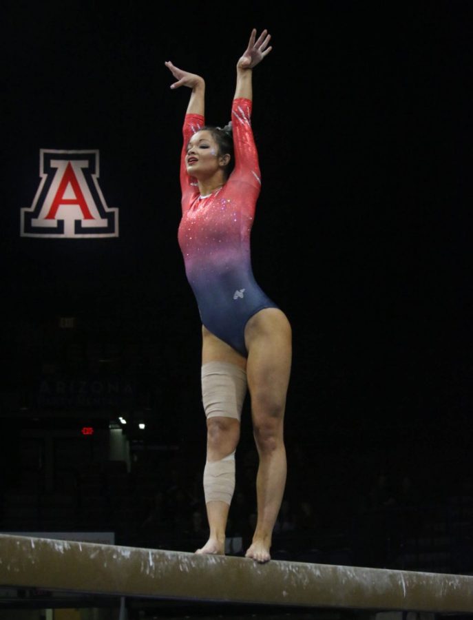 UA gymnast Courtney Cowles performs her routine on the balance beamduring the UA gymnastics team’s competition against Utah on January 26 in Mckale Center.