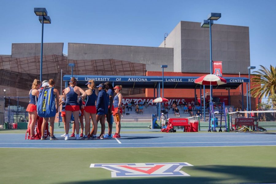 UA Women’s Tennis team huddle up and talk after the doubles matches against the University of Huston in Feb. 11, at the Robson Tennis Center, in Tucson, Ariz.