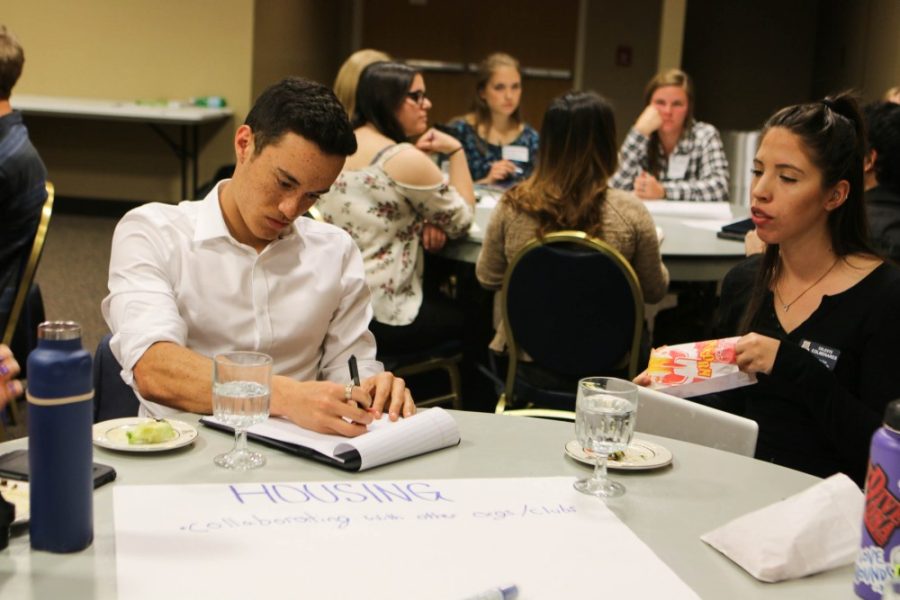 Alejandro Graterol, a student from Arizona State University, takes notes on ideas given by his peers about how to make housing more sustainable during the sustainability seminar at the University of Arizona Student Union on Friday February 23. Students involved with the sustainability programs from UA, ASU, and NAU all collaborated with each other to give suggestions on how to make their programs better.