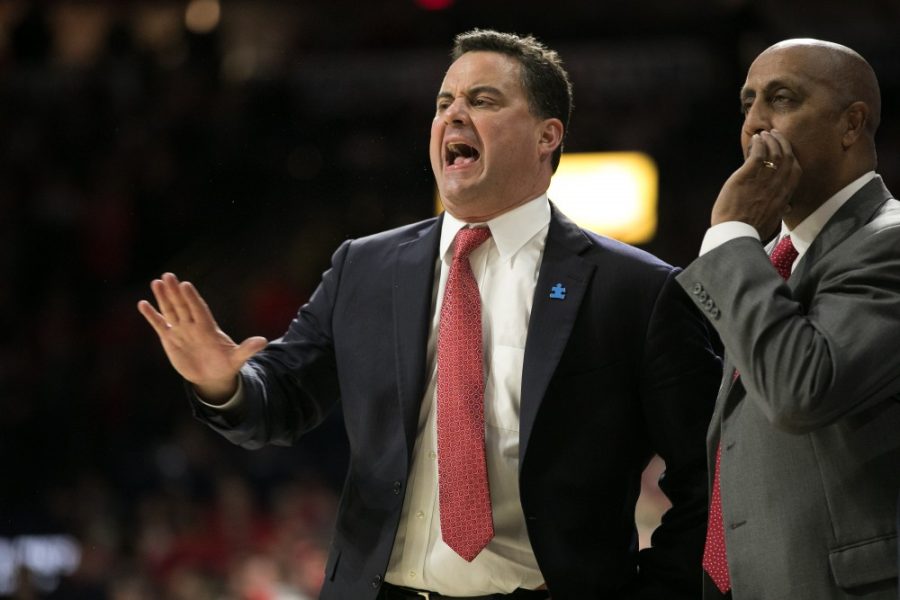 Arizona Mens Basketball Head Coach Sean Miller, left, yells at a referee while Assistant Coach Lorenzo Romar, right, watches in dismay during the first half of the UA-USC game on Saturday, Feb. 10 at McKale Center in Tucson, Ariz.