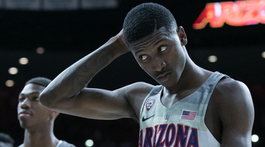 Arizonas+Dylan+Smith+%283%29+dejectedly+walks+off+the+court+after+the+UA-UCLA+game+on+Thursday%2C+Feb.+8+at+McKale+Center+in+Tucson%2C+Ariz.+The+Wildcats+lost+to+the+Bruins+with+a+final+score+of+82-74.