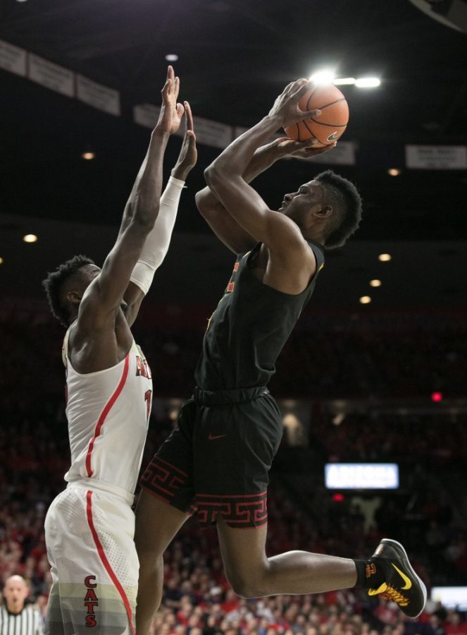 USCs Chimezie Metu, right, tries to shoot over Arizonas Deandre Ayton, left, during the first half of the UA-USC game on Saturday, Feb. 10 at McKale Center in Tucson, Ariz.