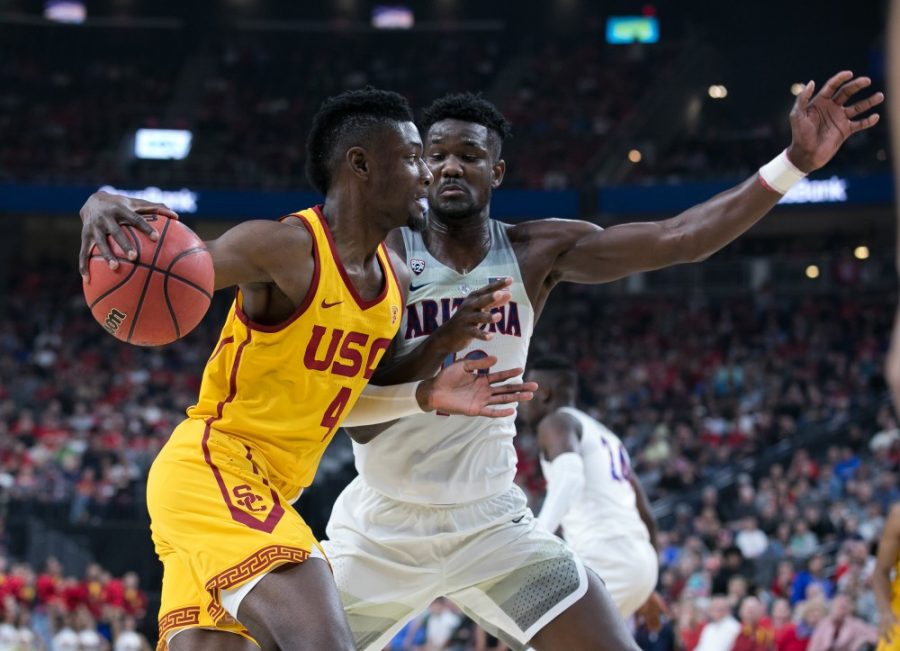 USCs Chimezie Metu (4) drives past Arizonas Deandre Ayton (13) to score in the Arizona-USC Championship game at the 2018 Pac-12 Tournament on Saturday, March 10 in T-Mobile Arena in Las Vegas, Nev.