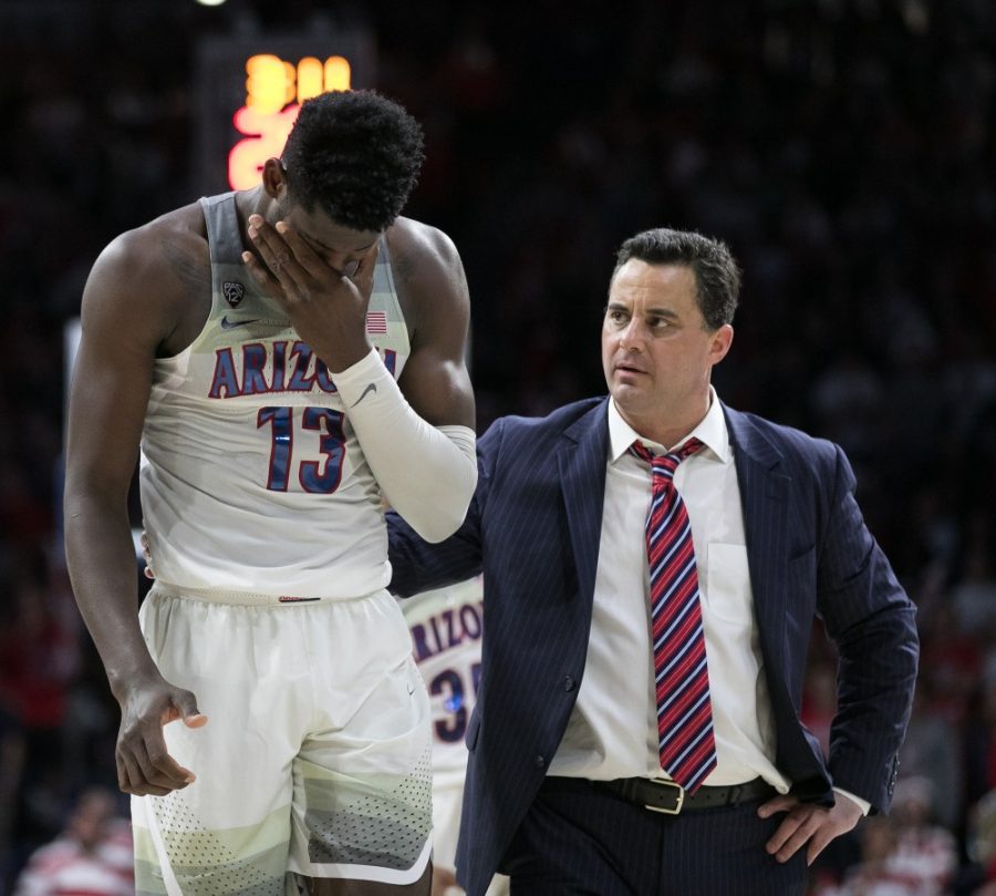 Arizonas Deandre Ayton (13) holds his mouth after being hit by a Stanford player during the second half of the Arizona-Stanford game on Thursday, March 1 at McKale Center in Tucson, Ariz.