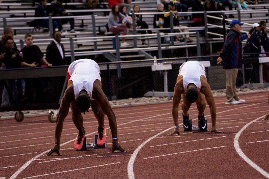 Zakee Washington (left) and Maj Williams (right) take their marks for the 200 meter race. Maj would go on to take the 2nd place title and Zakee taking third place respectively during the 2018 Willie Williams Classic on March 16, 2018.