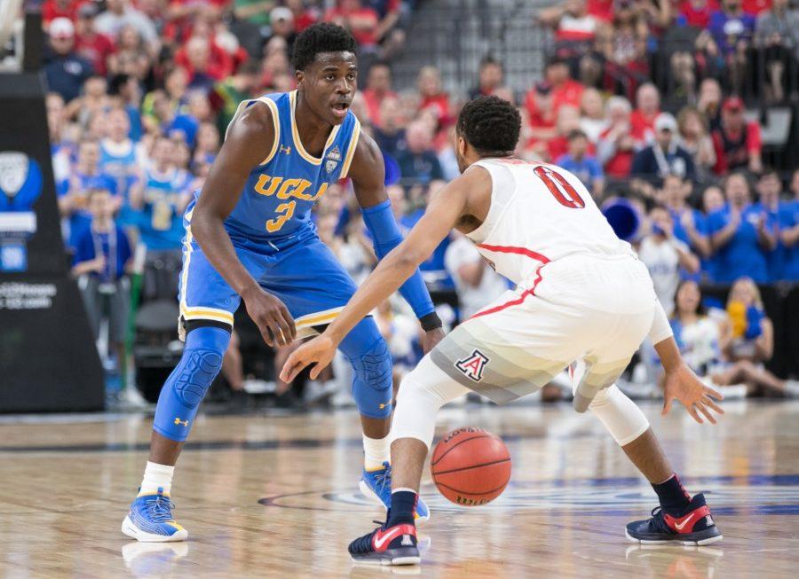 UCLAs+Aaron+Holiday+%283%29+looks+for+a+teammate+to+pass+to+past+Arizonas+Parker+Jackson-Cartwright+%280%29+in+the+first+half+of+the+Arizona-UCLA+Semifinal+game+at+the+2018+Pac-12+Tournament+on+Friday%2C+March+9+in+T-Mobile+Arena+in+Las+Vegas%2C+Nev.
