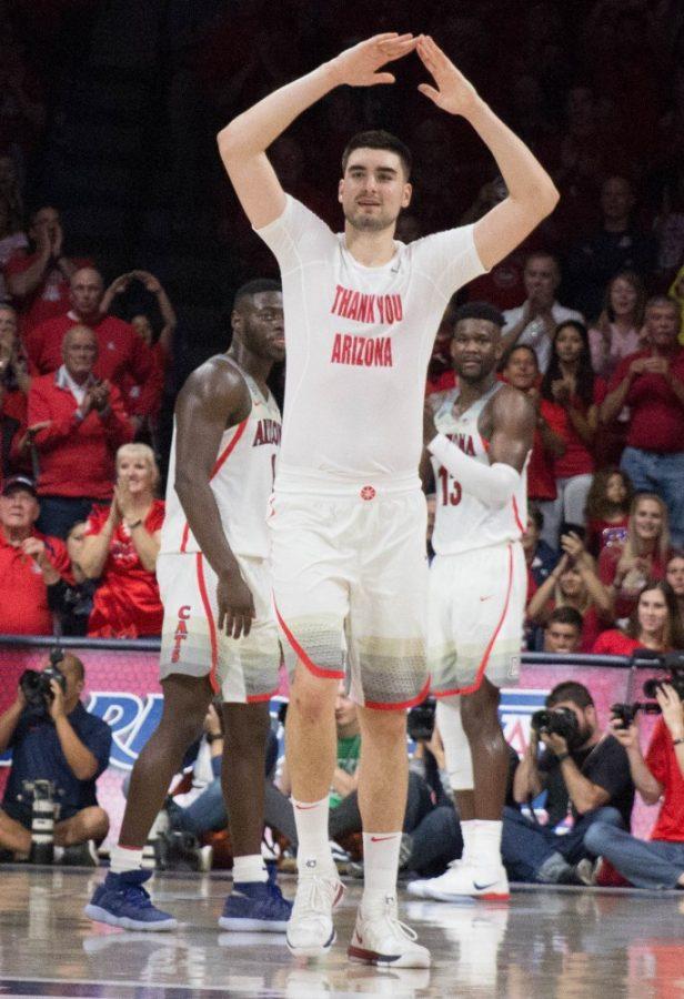 Arizonas Dusan Ristic (14) throws up his signature sign as he waves goodbye to the fans and steps of the Arizona court for the last time during the Arizona-California game on Saturday March 3 at McKale Center