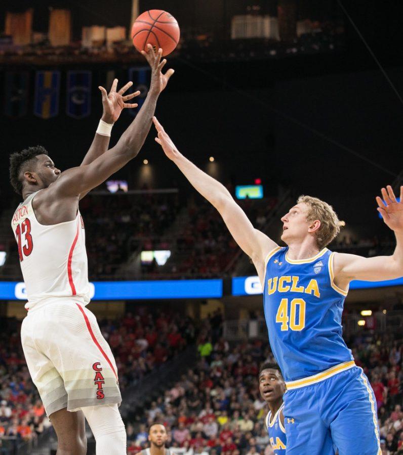 Arizonas Deandre Ayton (13) shoots over UCLAs Thomas Welsh (40) in the second half of the Arizona-UCLA Semifinal game at the 2018 Pac-12 Tournament on Friday, March 9 in T-Mobile Arena in Las Vegas, Nev. Ayton finished with a career high 32 points and 14 rebounds.
