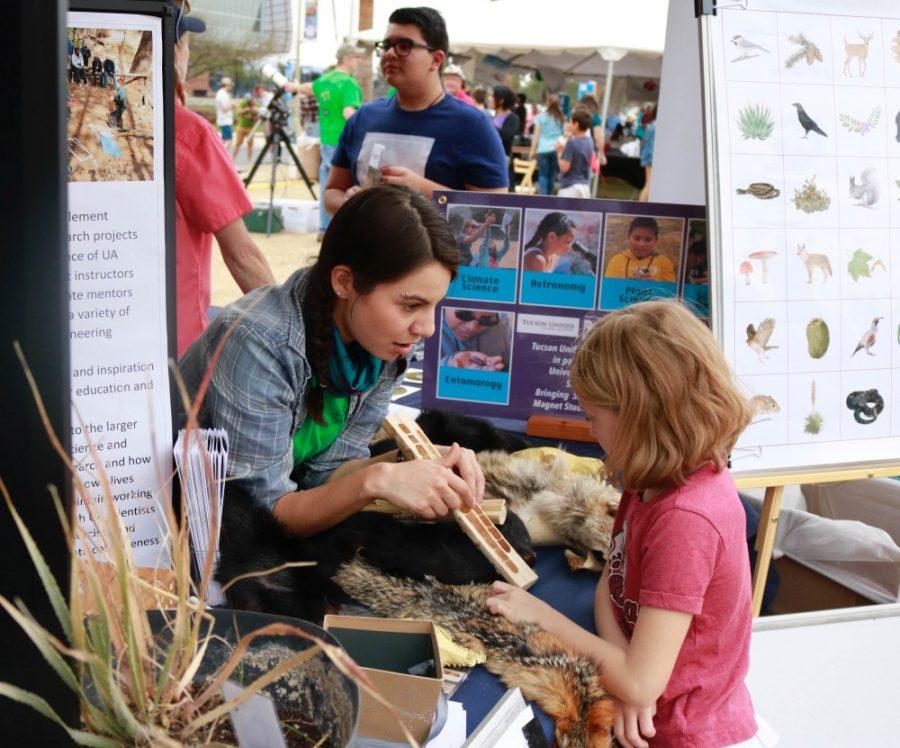 Volunteers+encourage+children+and+their+families+to+interact+with+the+many+exhibits++as+part+of+the+science+city+experience+at+the+tenth+annual+Tucson+Festival+of+Books+on+Saturday+March+10.