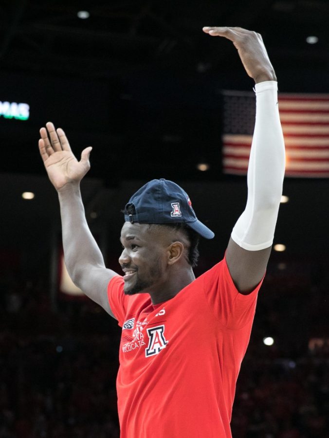 Deandre Ayton encourages cheers as he is recognized by head coach Sean Miller after the Arizona-Cal game on Saturday, March 3 in McKale Center.