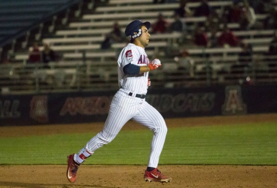Alfonso Rivas (25) hits a triple and bats a runner into home adding the first point to the scoreboard at the bottom of the 3rd inning during the Arizona-New Mexico State game on Tuesday March 20 at Hi-Corbett Field in Tucson, Ariz.