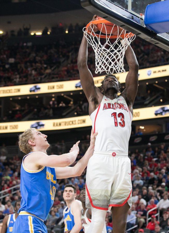Arizonas Deandre Ayton (13) dunks over UCLAs Thomas Welsh (40) in the Arizona-UCLA Semifinal game at the 2018 Pac-12 Tournament on Friday, March 9 in T-Mobile Arena in Las Vegas, Nev.