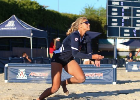 Arizona’s Caroline Cordes (25) runs to hit the ball during the Arizona-Utah beach volleyball game at Bear Down Beach, in Tucson Ariz. on Friday April 20.
