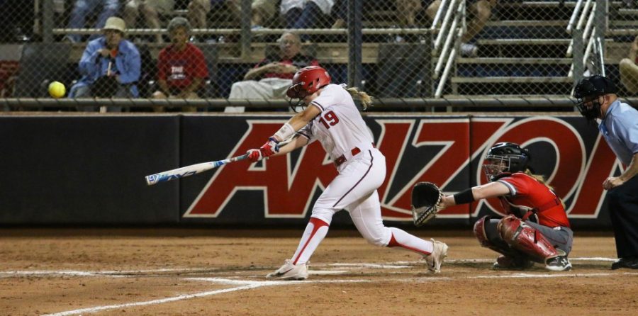 Arizonas Jessie Harper (19) hits a home run during the fourth inning of the Arizona-St. Francis game of the NCAA championship Tournament on Friday May 18 at the Rita Hillenbrand Stadium in Tucson, Ariz. The run scores the cats the first point of the game.