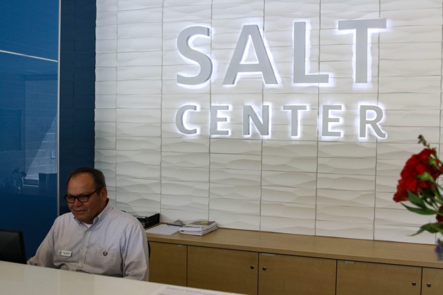 Oscar Luján mans the front desk of the SALT Center located on 2nd St. and Highland Ave.