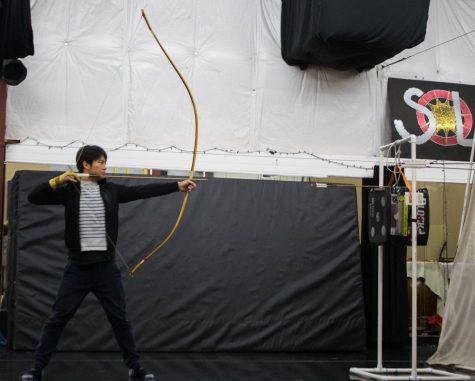 Cheng Tao, a UA grad student studying Physics, draws his second arrow back and prepares to shoot during practice on Sunday March 18 at Rhythm Industry Performance Factory in Tucson Arizona. Tao is a member of the UA Kyoto club which practices ancient japanese archery.