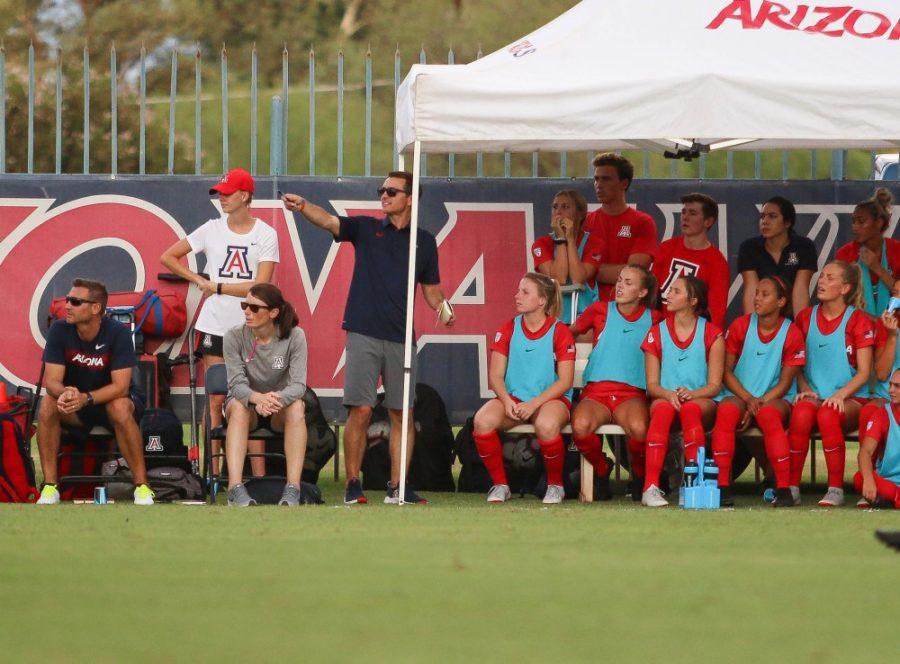 Arizona Womens Soccer head coach, Tony Amato, directs his sitting team to look at a play that is unfolding during the Arizona-Houston Baptist on Sunday, Aug. 26, 2018 at Mulcahy Stadium in Tucson, Ariz.