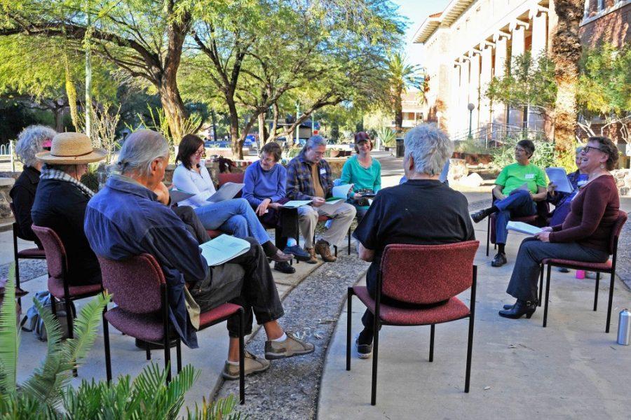A poetry group reads poems in front of Herring Hall. The UA Poetry Center, located on Helen St. and Vine Ave., hosts many events and speakers throughout the year, ranging from professional to student poets. 