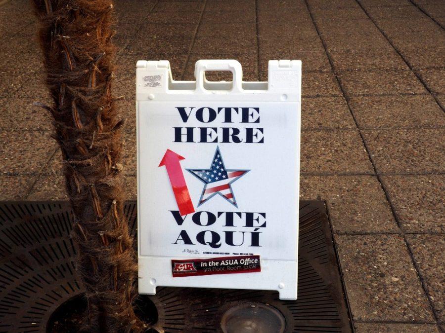 One of the signs placed at the Student Union Memorial Center guiding students and others to a voting station at the ASUA office.