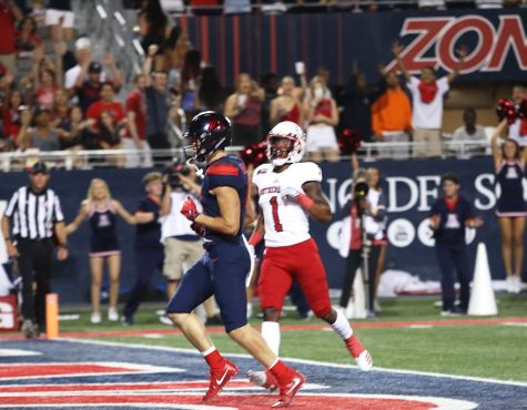 Tony Ellison (9) scores a touch down during the first quarter of the UA vs Southern Utah game on Sep 15.