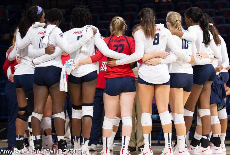 The Arizona wildcats hundle up before taking the court during the Arizona-SDSU match at McKale Memorial Center on Friday August 31 in Tucson Arizona.  The wildcats finished the match winning three games to zero.