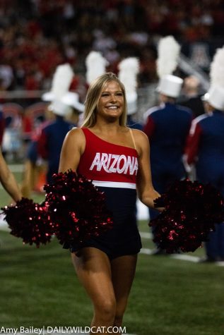 Arizona cheerleader smiles at the crowd before the start of the Arizona-USC game at the Arizona Stadium on Saturday September 29, 2018 in Tucson Ariz.