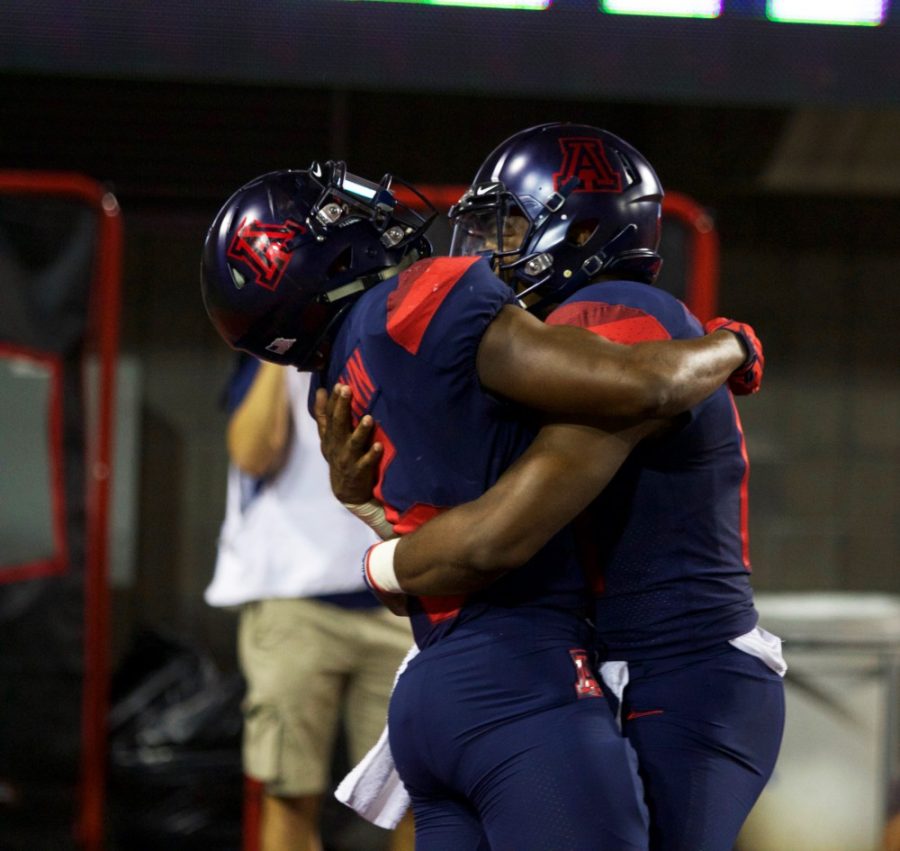 Shun Brown (6) hugs his teammate Khalil Tate (14) after scoring a touchdown against Southern Utah during the game on Saturday, Sep 16 at Arizona Stadium. 