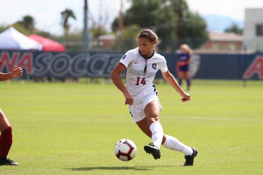 Arizonas junior forward Jill Aguilera dribbles the ball up towards the goal during the game against Washington State on Sunday, Oct 21 at Mulcahy Stadium. The final score was a 2-1 win for the wildcats.  