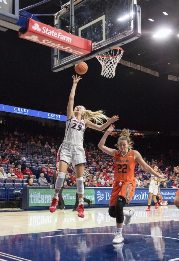 Arizona forward Cate Reese (25) throws the ball towards the net, scoring another point for Arizona during the home game against Idaho State on Friday Nov. 5, 2018. 