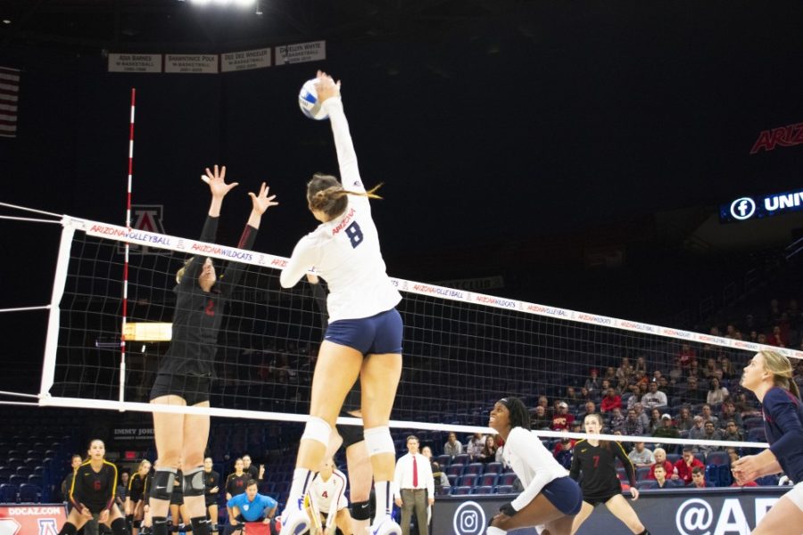 Number 8 Kendra Dahkle hits the ball over the net at the game against USC at the University of Arizona on Friday Nov. 16, 2018. UA lost the game in the fifth set. 