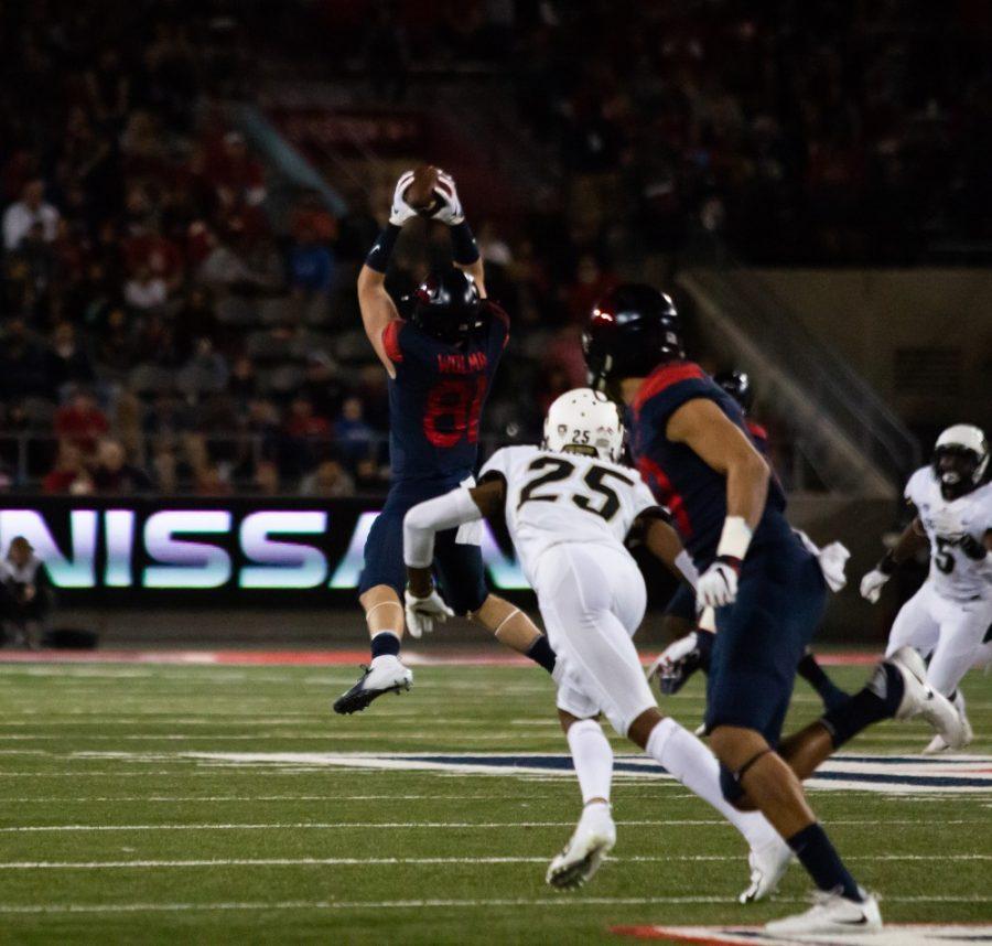 Bryce Wolma (81) catches a ball from Tate (14) giving the Wildcats another first down in  the Arizona-Colorado game on Nov. 2, 2018 at Arizona Stadium in Tucson, Az. Wildcats lead 26-24 at half.