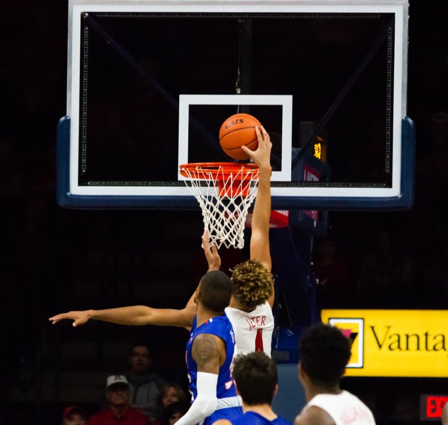 Arizona forward Chase Jeter (4) dunks the ball in the net during the second half of the Arizona-Houston Baptist  game at McKale Stadium on Nov. 7, 2018 in Tucson, Az.
