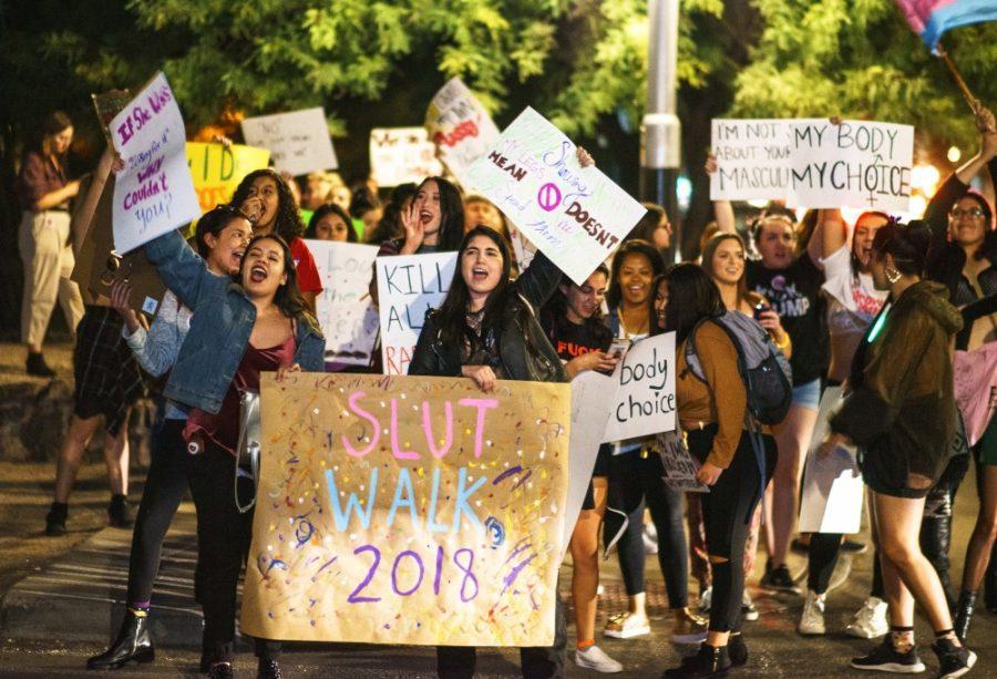 Protesters chant feminist songs as they walk down University Boulevard on Nov. 5, 2018 in Tucson, Ariz.