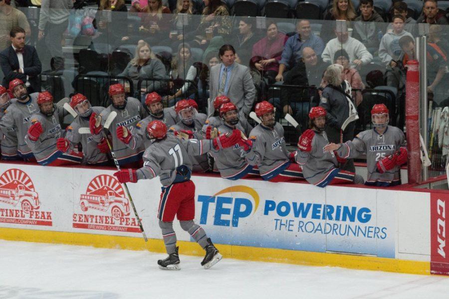 Bayley Marshall (11) celebrates with his teammates after scoring a goal to give the Wildcats a win in the Cactus Cup against Arizona State