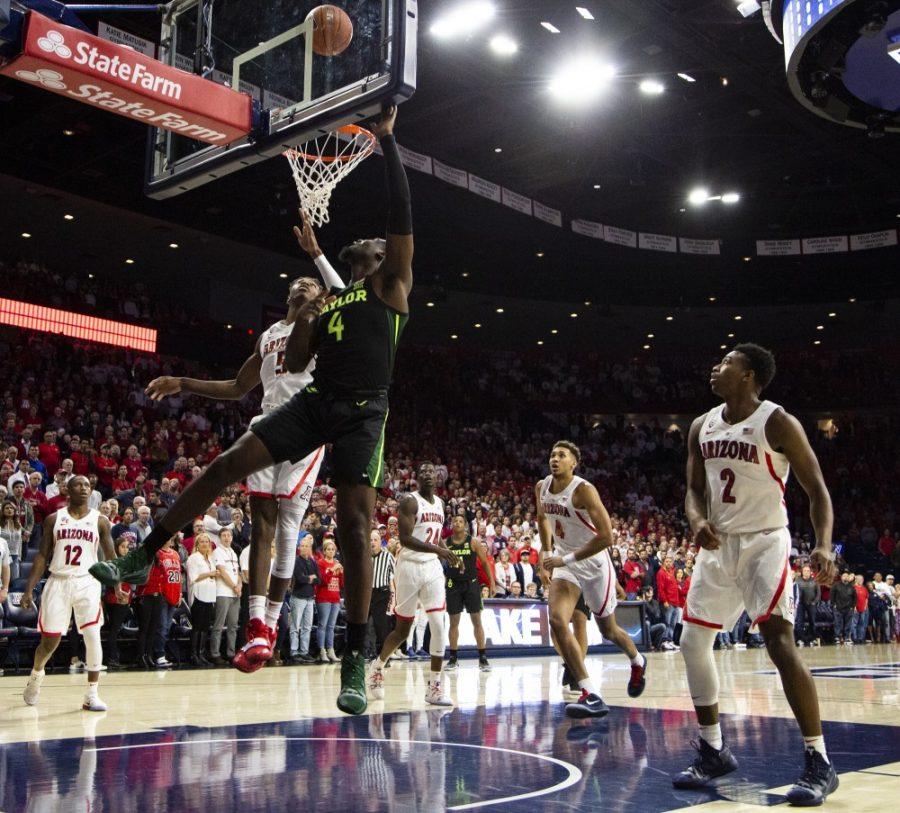 Baylors Mario Kegler (4) goes up for a layup during the Arizona-Baylor game on Saturday, Dec. 15 at the McKale Center in Tucson, Ariz.