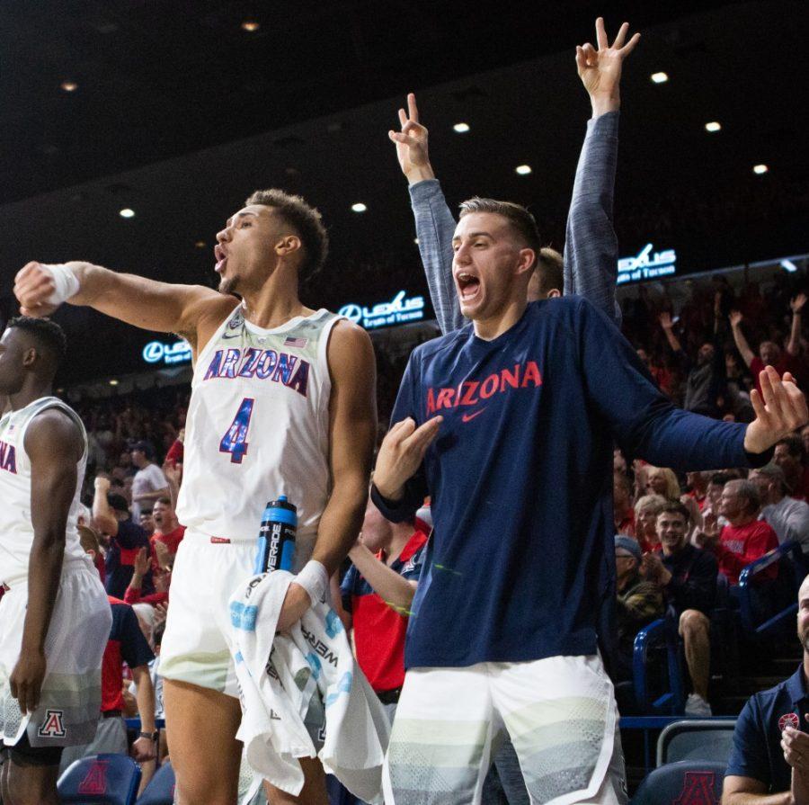 Chase+Jeter+and+Jake+Desjardins+celebrate+their+teammate+scoring+a+three-pointer+and+getting+a+lead+over+Utah+during+the+game+on+Saturday%2C+Jan.+5+at+McKale+Center.+After+a+tie+of+72-72%2C+Arizona+won+in+overtime+84-81.+