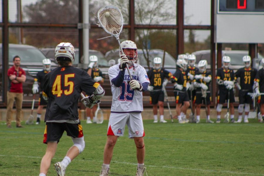 Wyatt Hill (#19) getting ready to pass the ball during the game vs. USC. On Saturday February 10th, the wildcats unfortunately lost to the California team with the score of 9-10.
