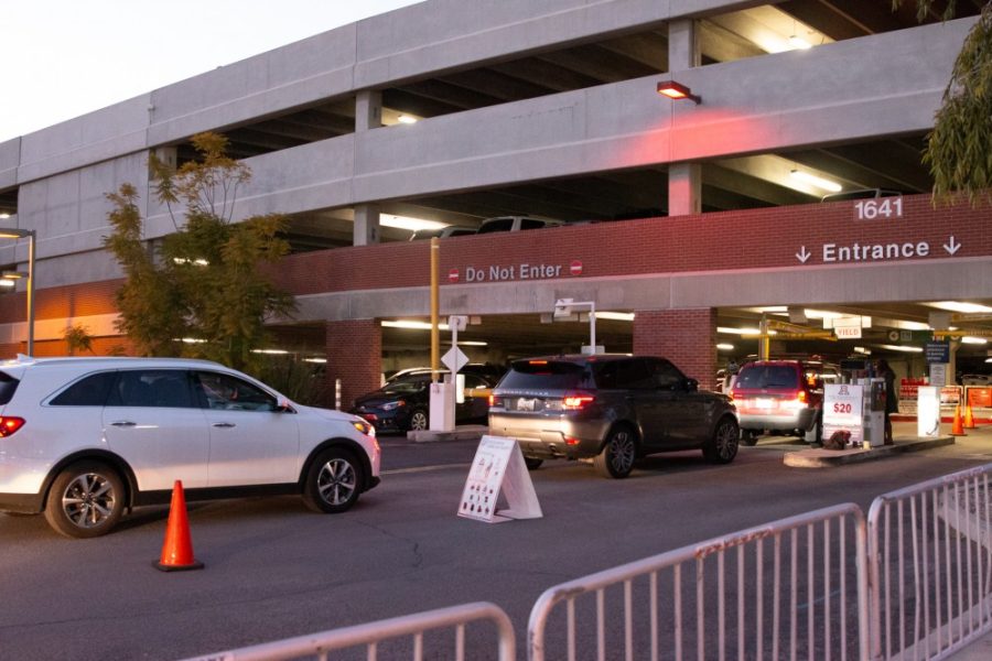 Cars drive into the Cherry Ave. Garage before a basketball game on Thursday, Feb. 7. 
