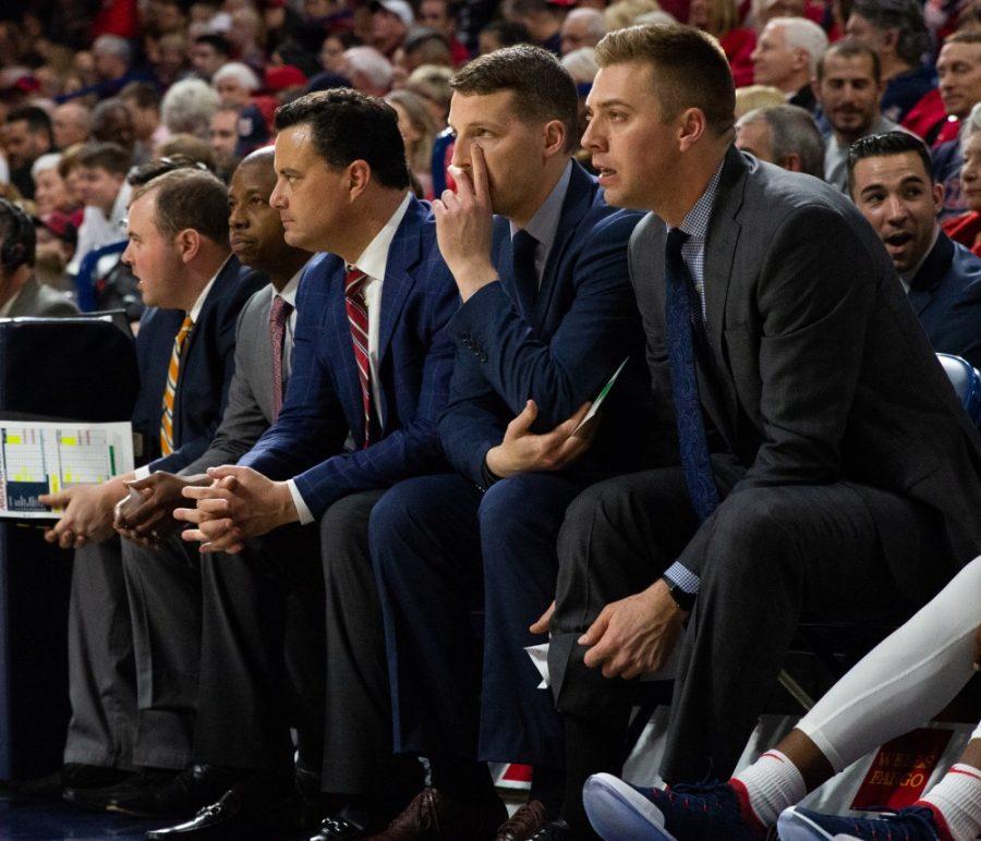 Sean Miller watches the game against Washington with his assistant coaches on Thursday, Feb. 7 at McKale Center. 