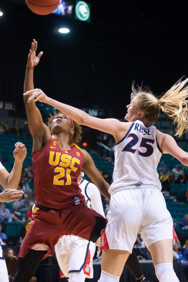 Forward Cate Reese (25) jumps to block USCs Aliyah Mazyck in the first round of the Pac-12 tournament on Thursday, March 7 at the Grand Garden Arena in Las Vegas, Nevada. Arizona beat USC 76-48. 